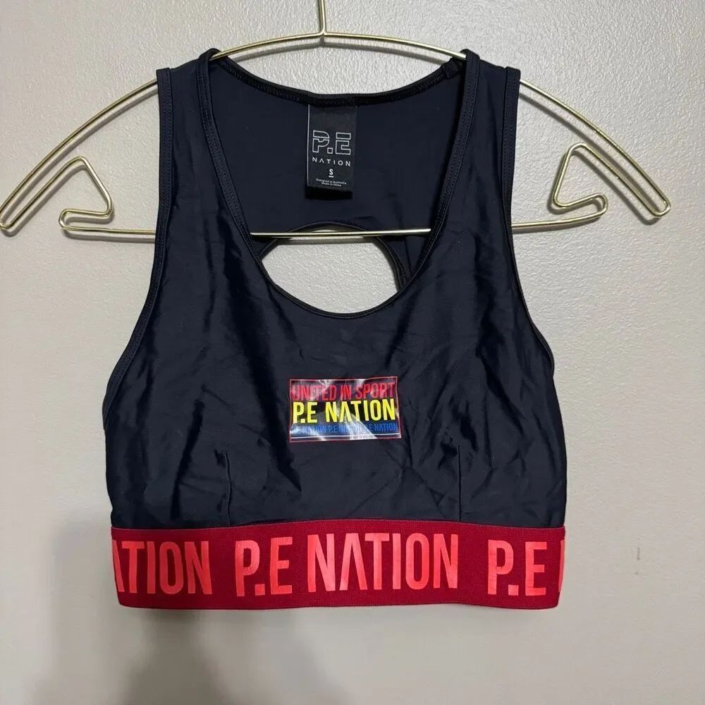 P.E Nation Figure Four Racerback Crop sports bra in black with a red logo size s